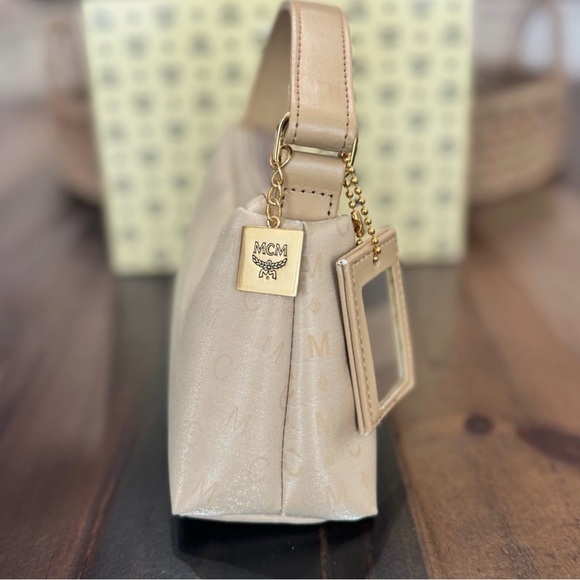 MCM Mini Top Handle Bag
Champagne Monogram Leather - Picture 6 of 15